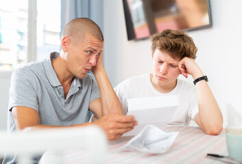 Father and son upset after reading college letter