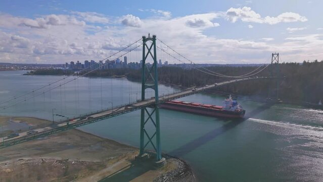 aerial view of Lions Gate bridge in Vancouver during sunrise with clouds