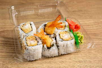 A grocery store plastic takeout package of Tempura Shrimp Roll sushi