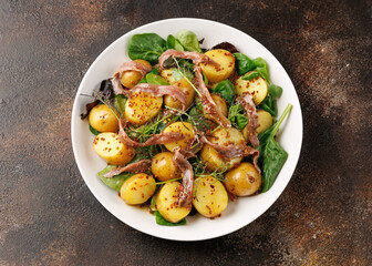 Warm salad with anchovy and baby potatoes and wholegrain mustard