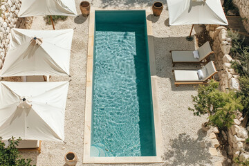 Elegant Private Swimming Pool Oasis Surrounded by Chic White Umbrellas and Comfortable Loungers