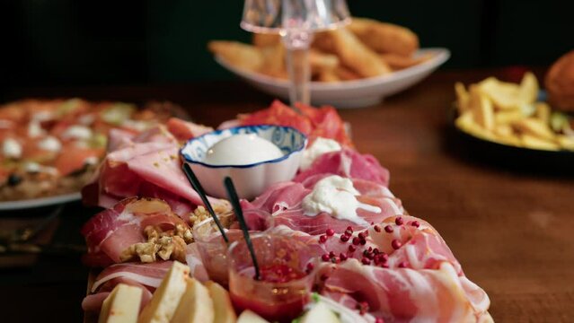 Cutting Board With Cured Meats Salame, capocollo, Mortadella, and cheese