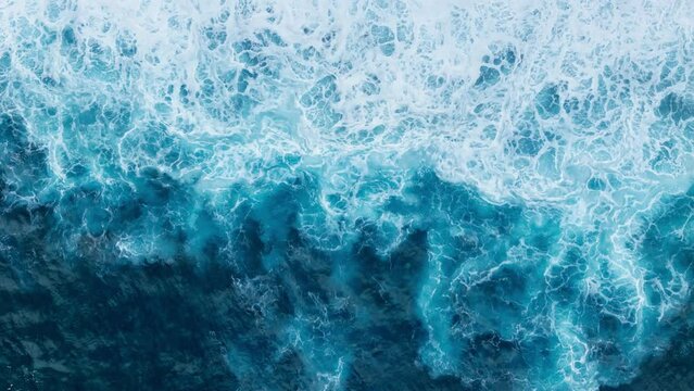 Rough ocean waves with foam on coast Madeira island in Atlantic ocean, Aerial top down view