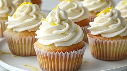 Delicious cupcakes with white cream and lemon zest on plate, closeup. Generative Ai