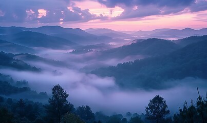 A misty mountain morning, with valleys below obscured by a blanket of fog