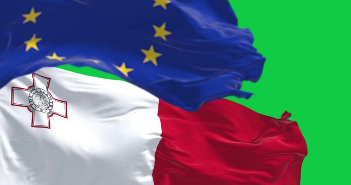 Close-up of Malta and the European Union flags waving isolated on green background