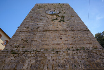 View of the Torre del Candeliere, a medieval tower with clock. Massa Marittima, Grosseto, Tuscany,...