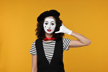 Funny mine with beret posing on orange background