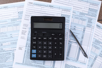 Tax accounting. Calculator, documents and pen on table, flat lay
