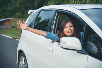 Happy asian women drive new car. Women Hand give remote control car key to man rental car service. Close up hands young woman showing new car key. Women driver giving car rental service smiling face