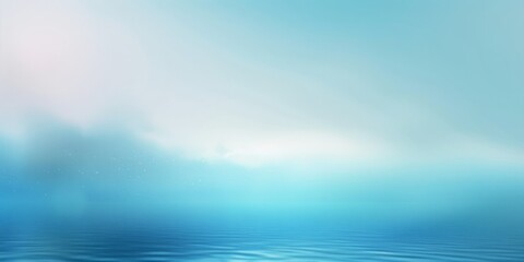 A blue ocean with a cloudy sky in the background
