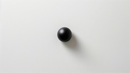 A minimalist white canvas with a small black dot in the center.