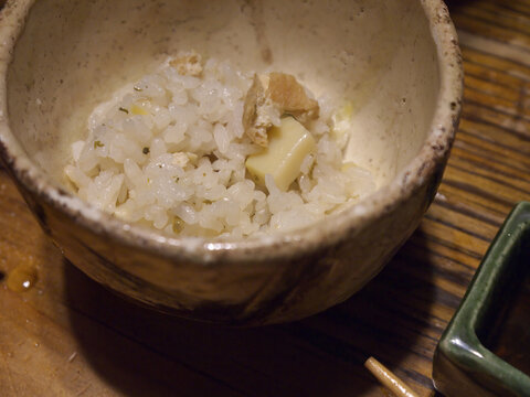 Japanese Chahan fried rice with scrambled egg and tofu in ceramic bowl close up