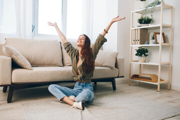 Relaxing in a Cosy Modern Apartment: A Happy Woman Enjoying Comfortable Home Life on a Sofa