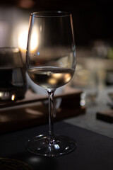 Designer cocktail and wine in a dark bar environment. Fine Dining concept. Food and drinks lifestyle.