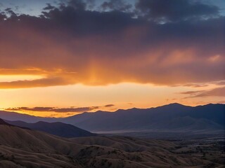 Naklejka premium sunset over the mountains