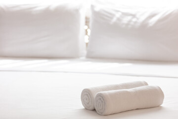Close up of towel on bed. Cozy room interior. Concept of domestic living.