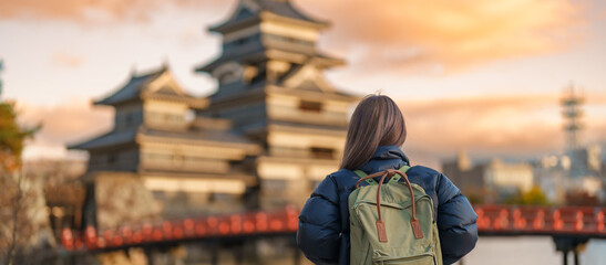 Woman tourist Visiting in Matsumoto, happy Traveler sightseeing Matsumoto Castle or Crow castle....