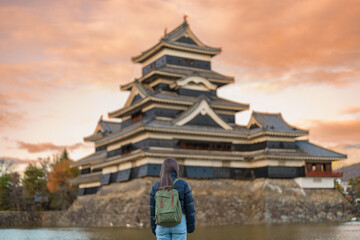Woman tourist Visiting in Matsumoto, happy Traveler sightseeing Matsumoto Castle or Crow castle....