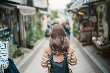 Woman tourist Visiting in Enoshima Island, Fujisawa, Kanagawa, Japan. happy Traveler sightseeing...