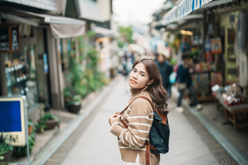 Woman tourist Visiting in Enoshima Island, Fujisawa, Kanagawa, Japan. happy Traveler sightseeing...
