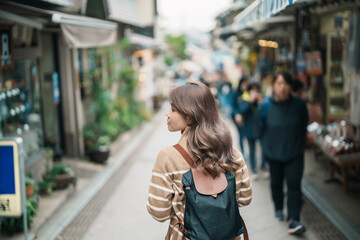 Woman tourist Visiting in Enoshima Island, Fujisawa, Kanagawa, Japan. happy Traveler sightseeing...