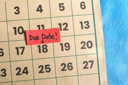Due date and deadline reminder concept. Marked calendar date with note.