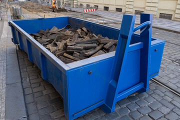 rubber waste. industrial container filled with construction debris, emphasizing the management and ...