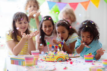 Kids birthday party. Children with cake and gifts