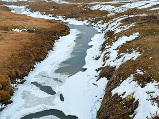 Snow and Ice amalgamated in the Water. Location - Gulmarg, Kashmir, India