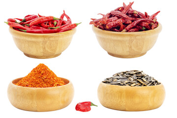 Cayenne pepper and fresh red chili with sunflower seeds in a wooden bowl chili spicy seasoning Isolated on a white background - clipping path.