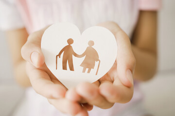 Hands holding elderly couple with walking sticks in heart shape, older people mental health, age...