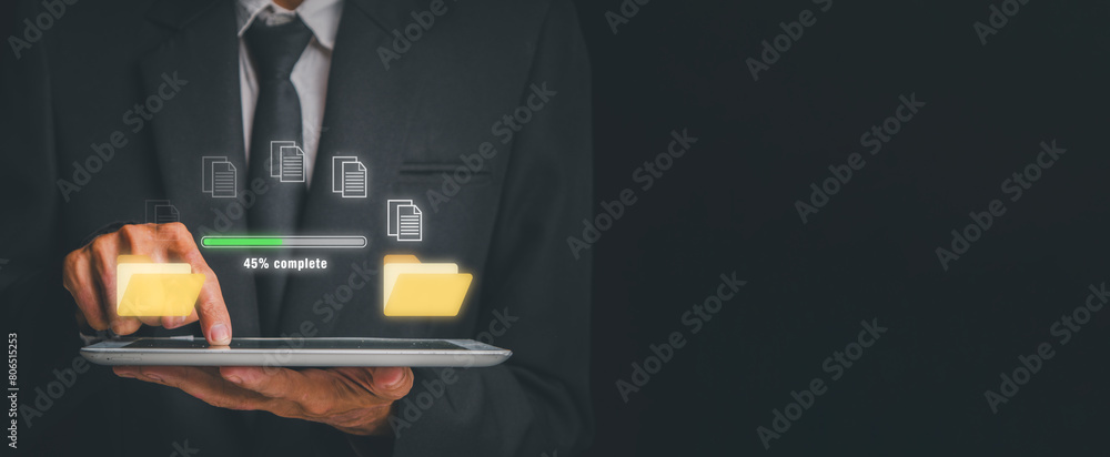 Poster transfer file concept, businessman using digital tablet with transfer file icon on virtual screen.