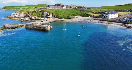 Aerial view of visitors having fun at Portmuck Harbour Islandmagee Co Antrim Northern Ireland
