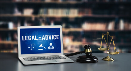 Smart legal advice website for people searching for savvy law knowledge in laptop computer on a desk in library of university or college