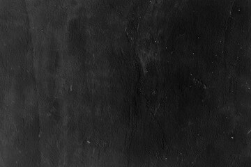 Black grunge stucco wall texture background.