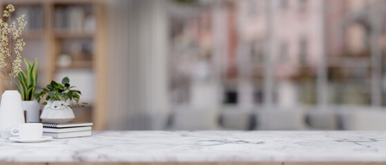 A white marble table against a blurred background of a living room.