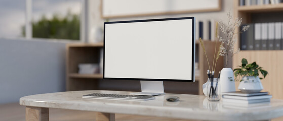 A computer white-screen mockup on a luxury marble table in a modern office or home office.