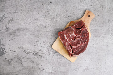 Fresh Raw Beef Over Gray Background.