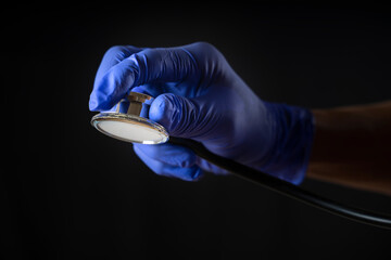 hand holding Stethoscope