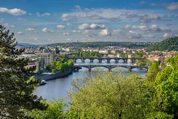 Old town of Prague. Czech Republic over river Vltava with Charles Bridge on skyline. Prague panorama landscape view with red roofs. Prague view from Letna Park, Prague, Czechia.