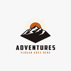Outdoor adventure travel badge logo with sun and mountain landscape vector illustrations template