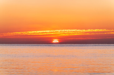 Beautiful red and orange sunrise over the sea.