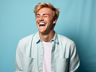 A man with is smiling and laughing