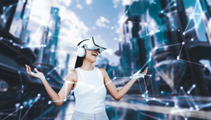 Female stand wear white VR headset and white sleeveless connect metaverse, future technology create...