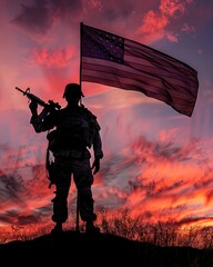A soldier stands on a hill holding a flag