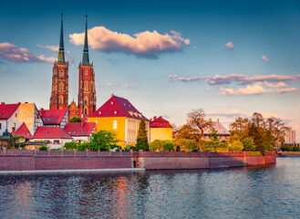 Colorful spring view of Tumski island with two spire of cathedral of St. John on Odra river....