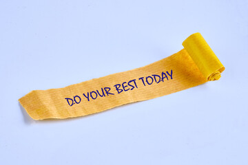 Business motivational. Do your best today symbol on torn paper on a blue background