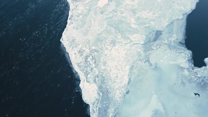 aerial view of froze ice glacier melting in artic drone fly close to glacier melting causing rising sea level global warming climate change concept - Powered by Adobe