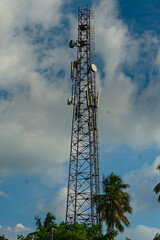 picture of a tall mobile communication tower standing in clear sky background